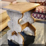 F63. Weathered wooden stool. 